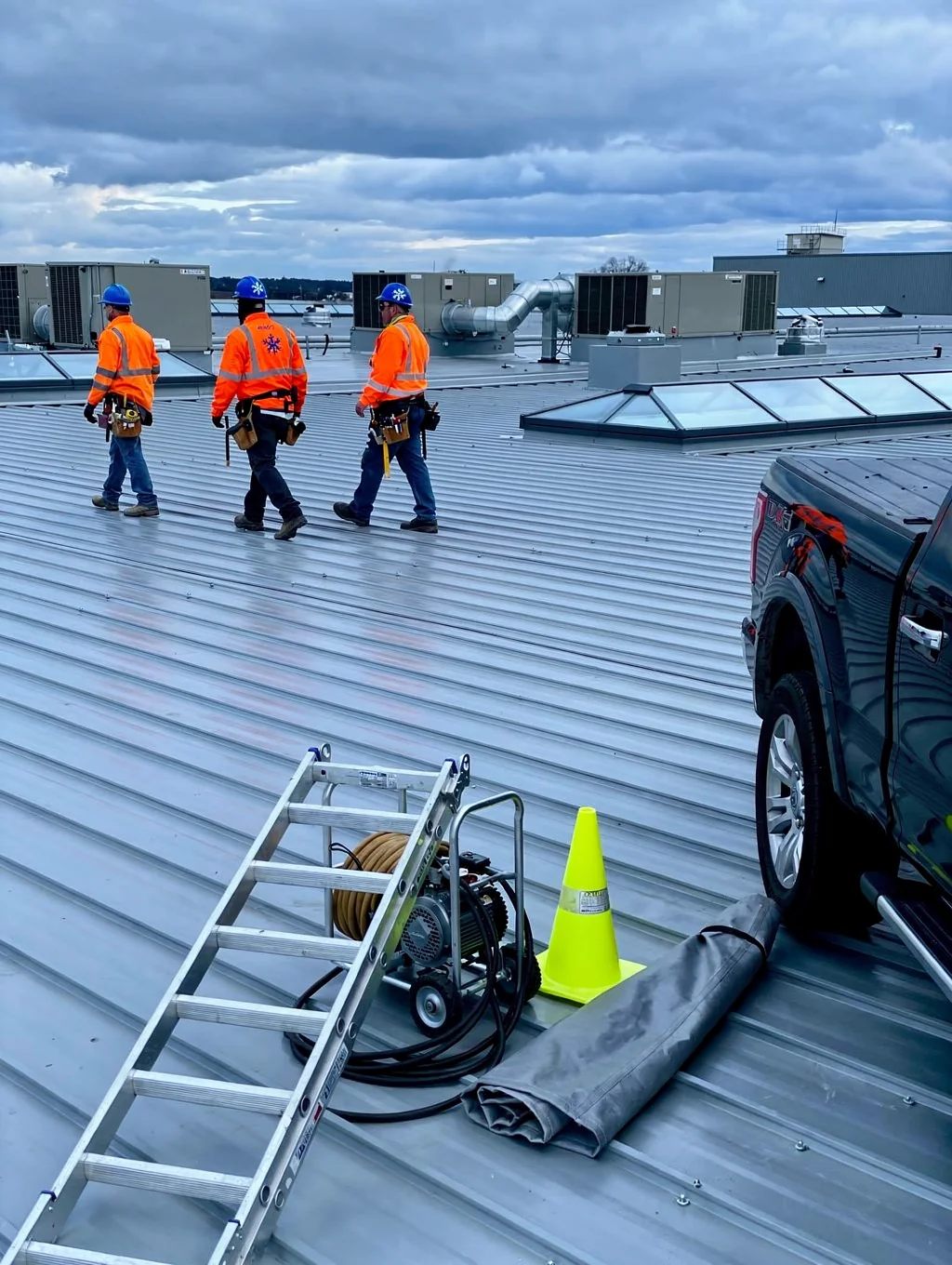 Commercial building roof maintenance in progress